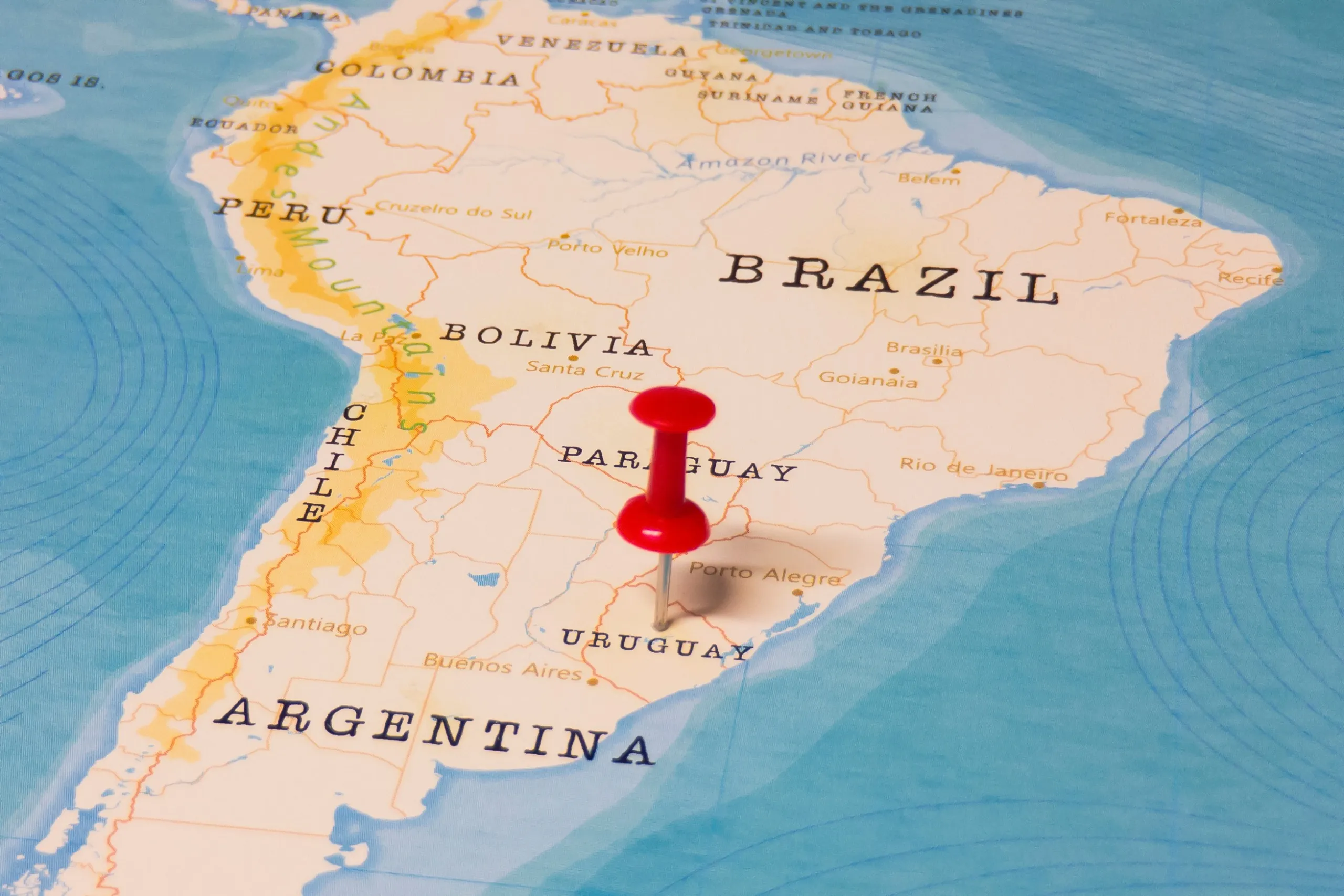 Map with a pin marking the location of Uruguay on it
